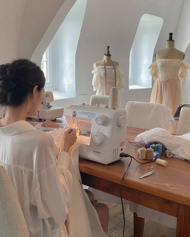 Tailor working with fabric and sewing machine